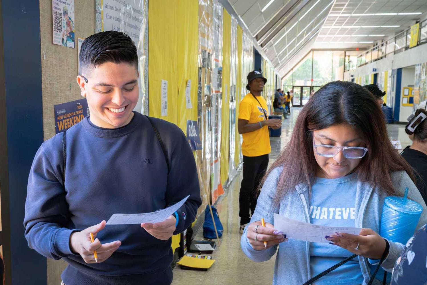 Two students looking at a paper