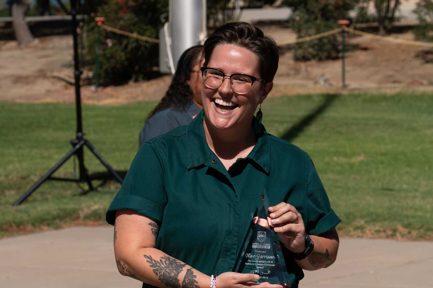 Olive Garrison receiving rainbow campus champion award