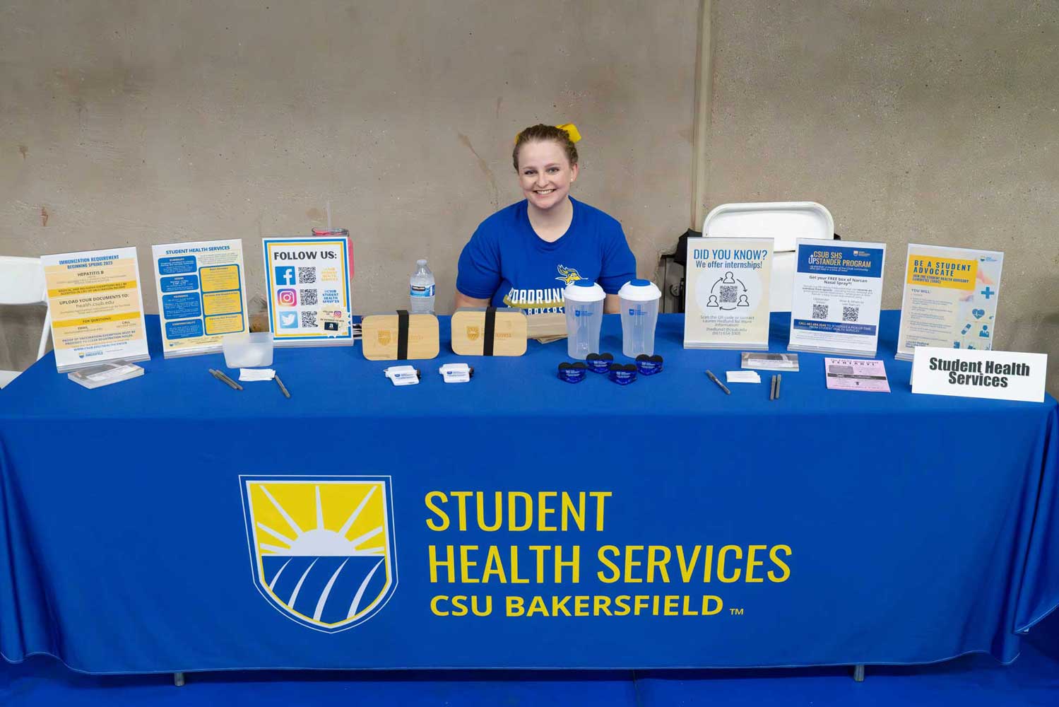 Staff member at the Student Health Services table