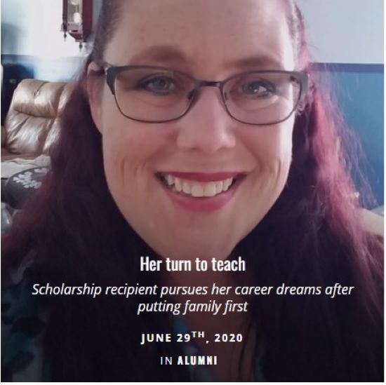 Woman with red hair and glasses