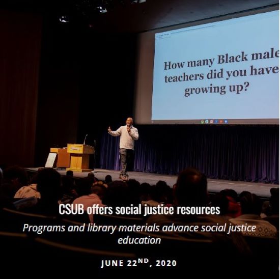 Man on stage giving presentation