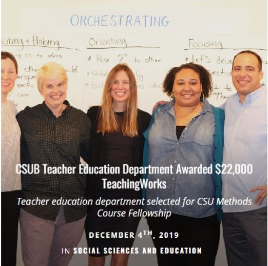 Five adults standing in front of whiteboard