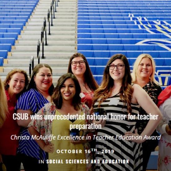 Group of women standing in front of bleachers