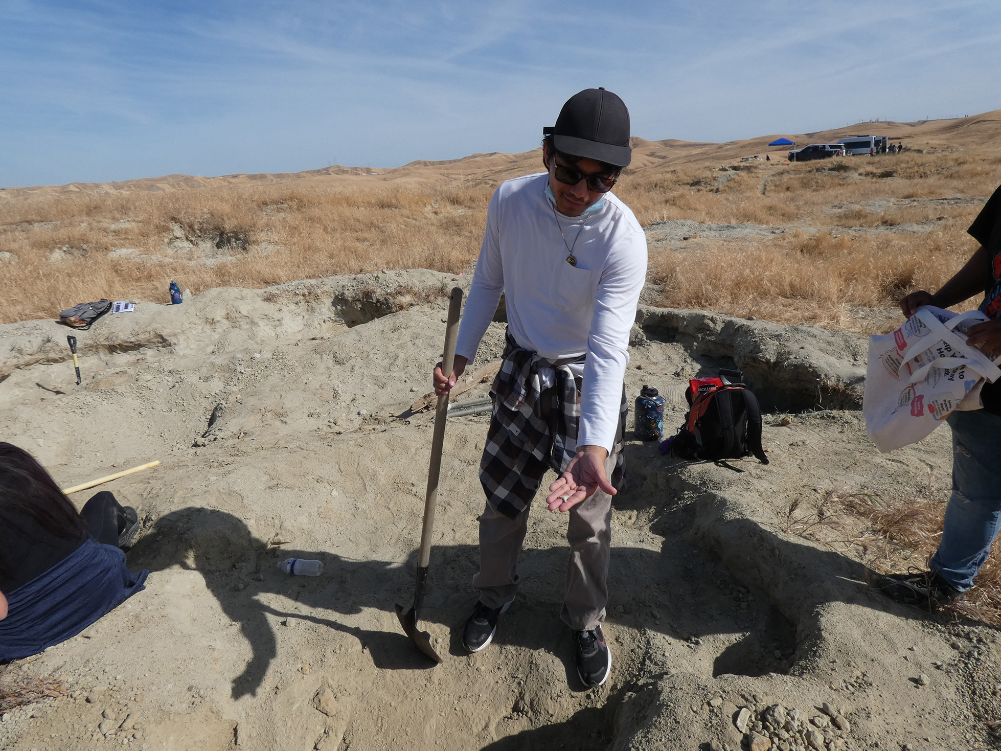 Geology student Esteban shows off his fossil find