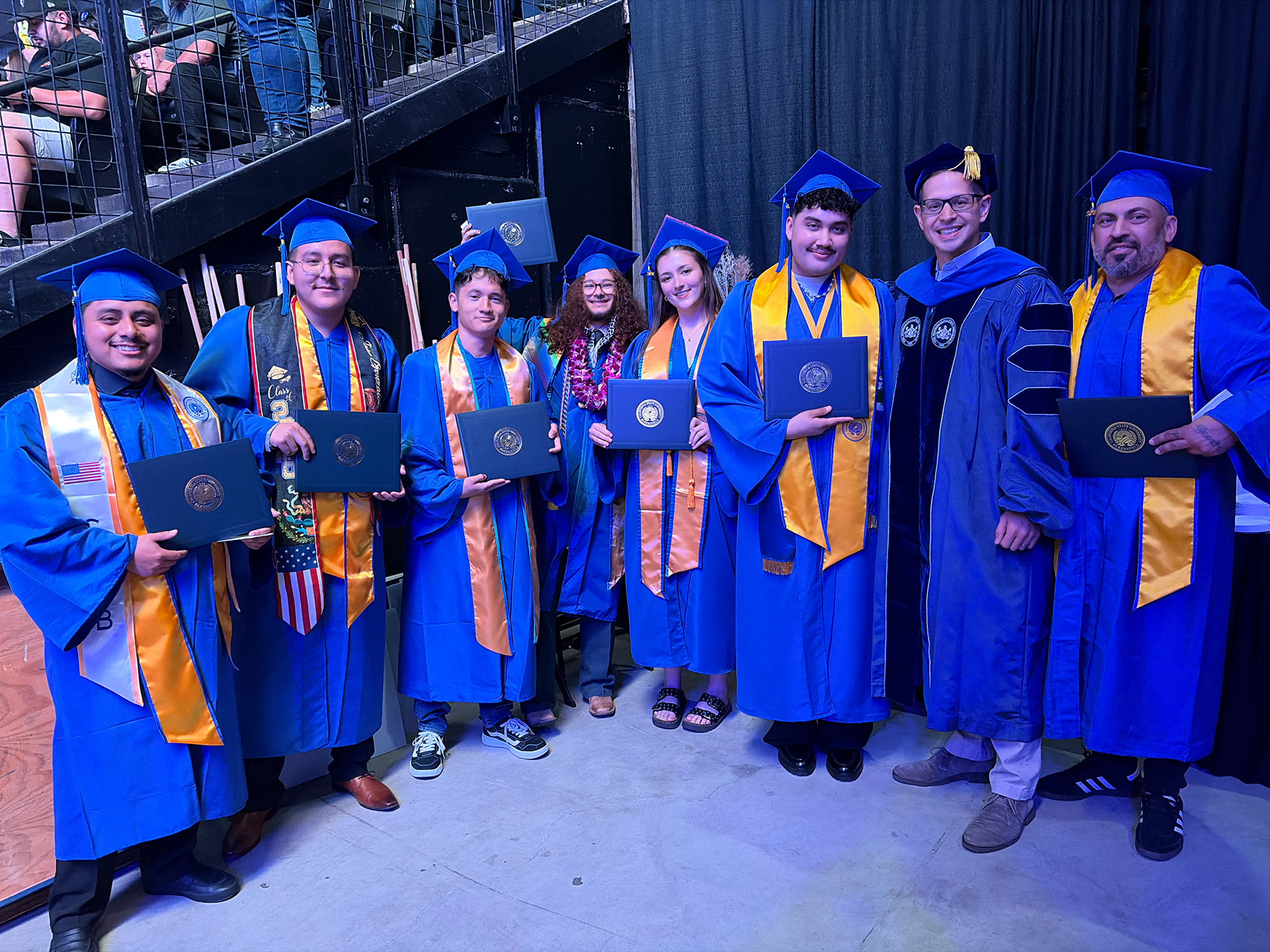 Jose Z, Jose G, Andrew, Elijah, Brooklyn, Sal, Dr. Herman, and Javier pose for a graduation picture