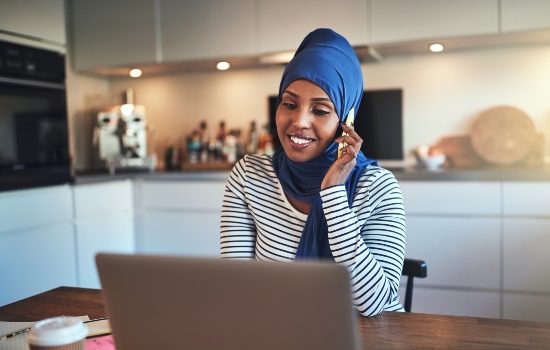 Woman at home working on a laptop