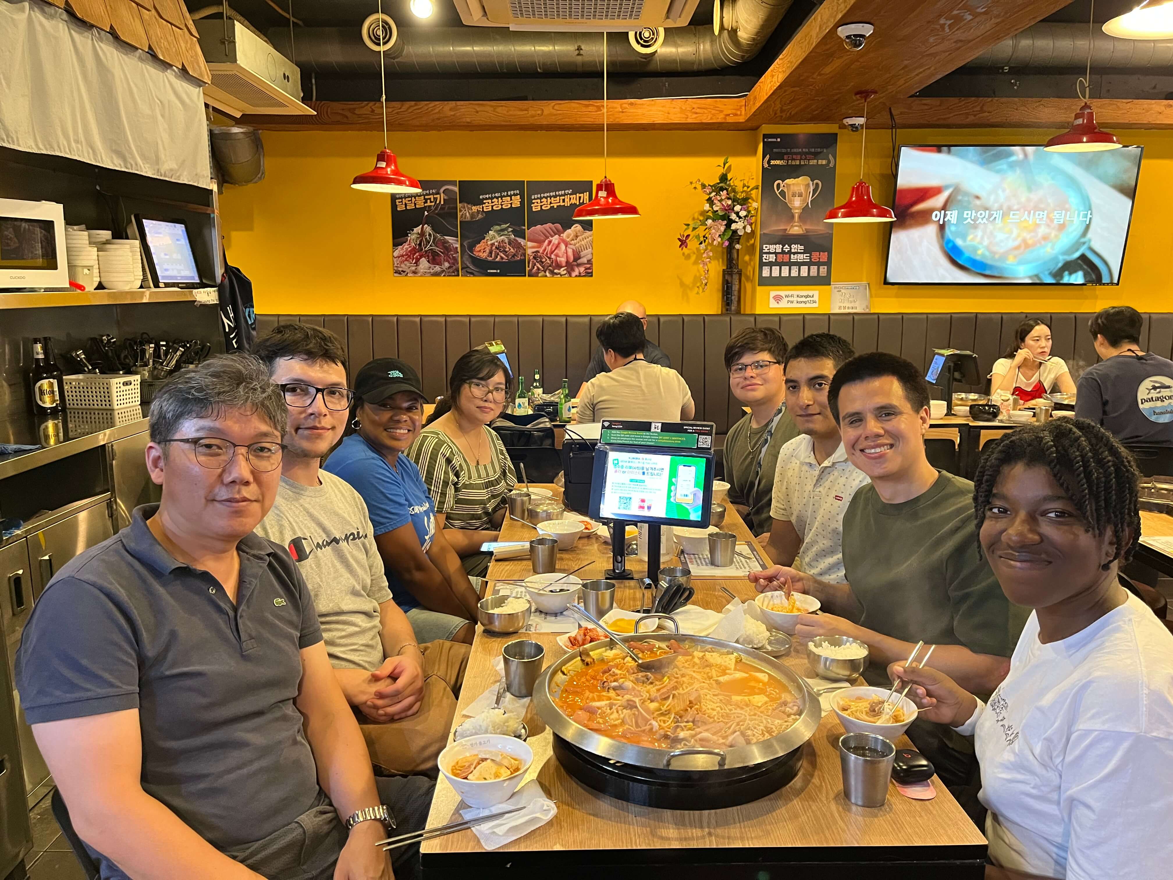 FLP Korea students and Dr. Kim enjoying local cuisine at a restaurant.